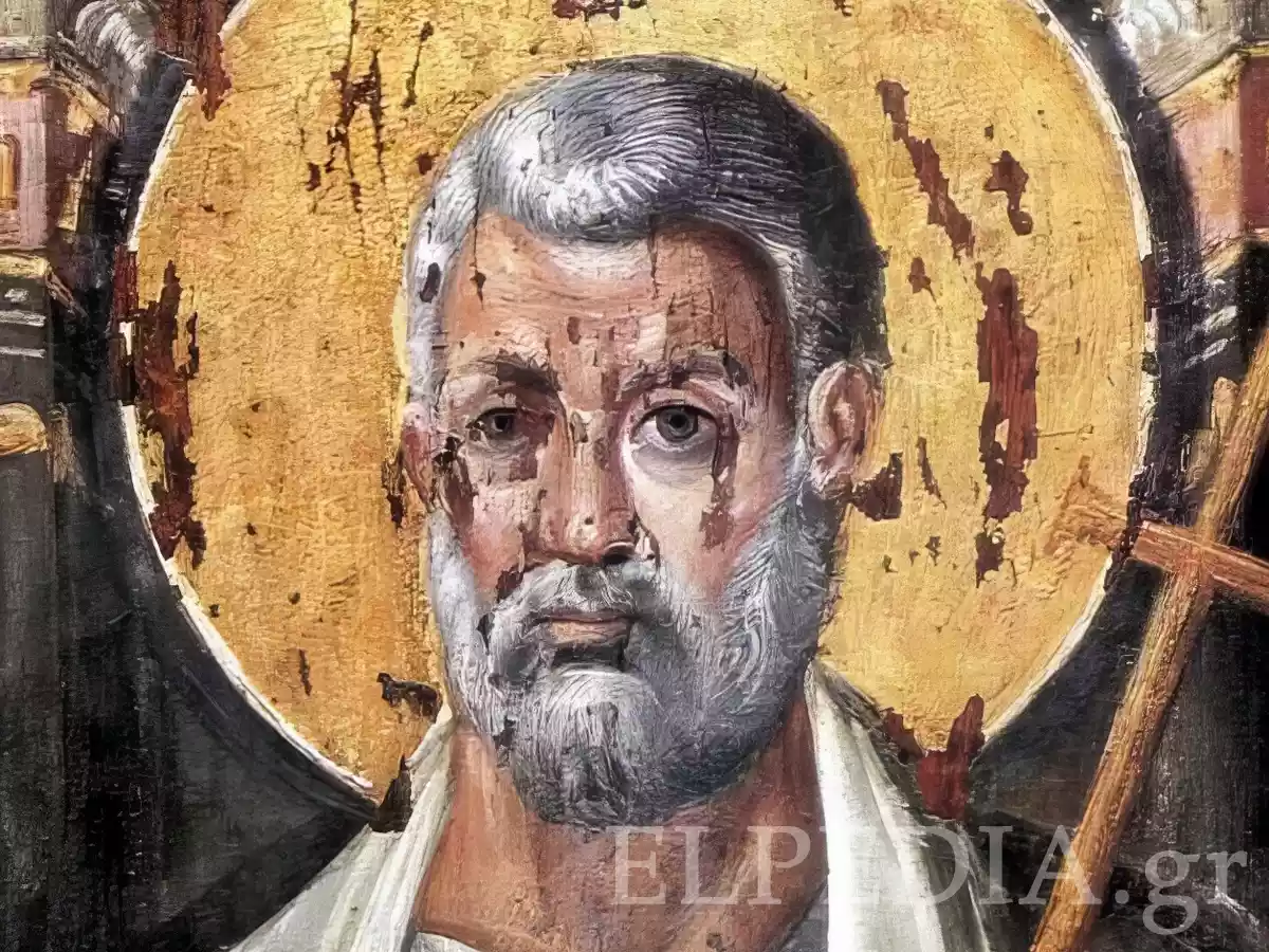 Close-up detail of Saint Peter's face from an encaustic icon, showing weathered skin tones, penetrating gaze, gray hair and beard, against a golden nimbus background.